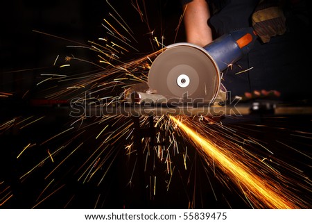 detail of electric grinder tool in action