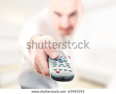selective focus image man with remote tv control