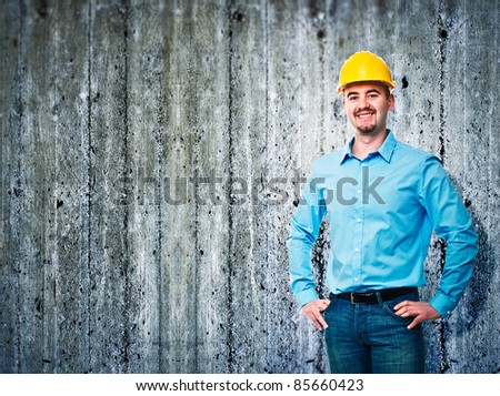 smiling worker and concrete texture background
