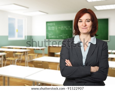 portrait of caucasian teacher and classroom background