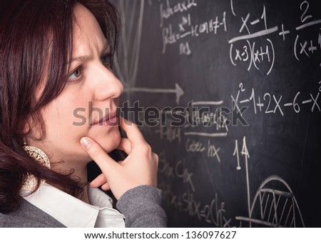 portrait of woman teacher and blackboard background