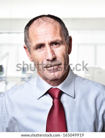 portrait of senior  and office background