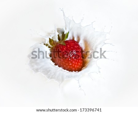 red  Strawberry splash in milk background