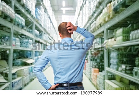 thinking man and shop warehouse background