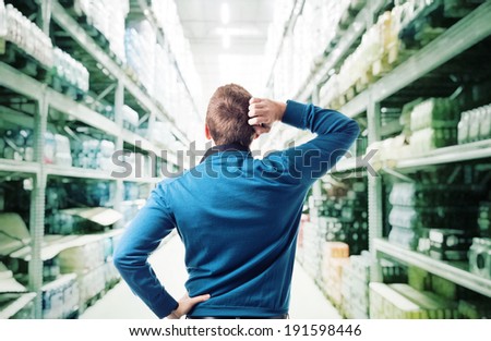 thinking man and shop warehouse background