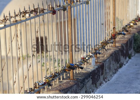 Oia,Santorini, GREECE - June 14, 2015:padlocks with love message left on the fence of the castle of Oia