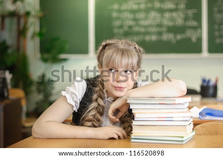 schoolgirl Schoolgirl; class; skilet; books; a blackboard; a desk; green; learn; act; young; girl; man; people; education; emotions; fear;