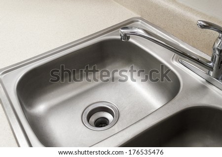 Empty Stainless Steel Kitchen Sink/ Horizontal Shot/ Close Up/ Chrome Faucet