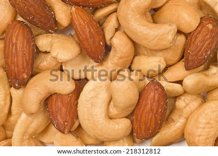 Cashews And Almonds/ Mixed Nuts/ Horizontal Shot/ On White Background