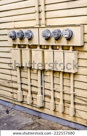 Vertical Shot Of Electric Meters On Old House/ Old Electric Meters