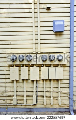 Vertical Shot Of Electric Meters On Old House/ Electric Meters