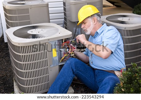 Air Conditioning Repairman At Work/ Horizontal Shot