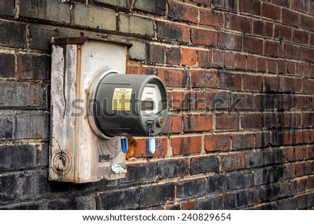 Horizontal Shot Of An Old Electric Meter On Old Commercial Building