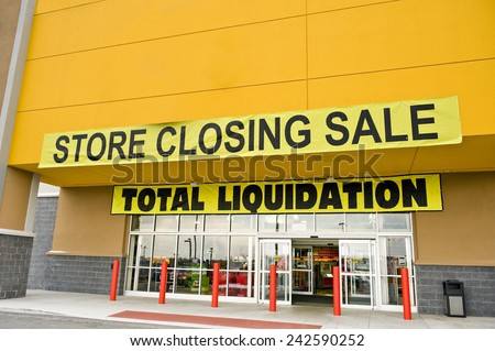 Front Shot Of Yellow Store Closing Sale