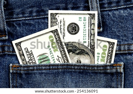 Close Up Shot Of Fake Hundred Dollar Bills In Jean Pocket/ Money In The Pocket
