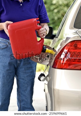 Adding Gas In Car With Plastic Gas Can Vertical