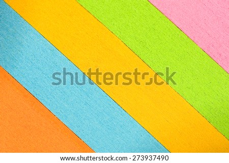 Slanted multi-colored stacks of paper as background/ Slanted Colored Paper Background