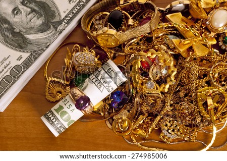 Hundred Dollar Bill (Not Real) Inside Gold Ring With Money(Fictitious) and Gold Jewelry