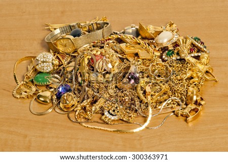 Gold jewelry pile on counter/ Pile Of Gold Jewelry