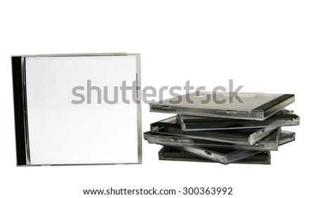 Blank CD cases stacked with one standing/ Stack Of CD Cases
