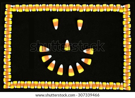 Candy corn happy face with candy corner border on black background/ Candy Corn Border and Happy Face