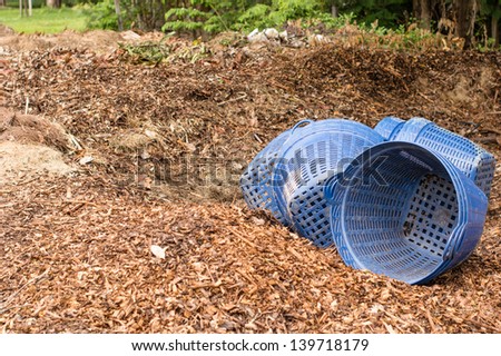Organic compost with blue trash basket