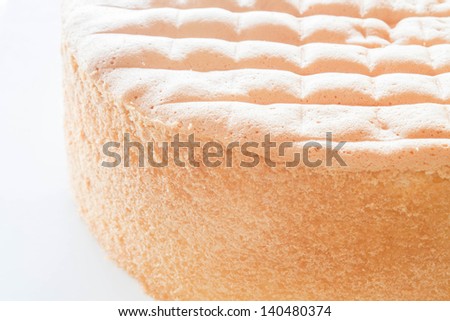 Vanilla sponge cake base for decoration on white background