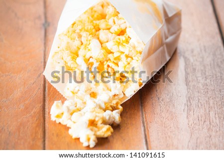 Popcorn pack opened with corn spilling out
