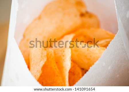 Opened bag of delicious spicy potato chips