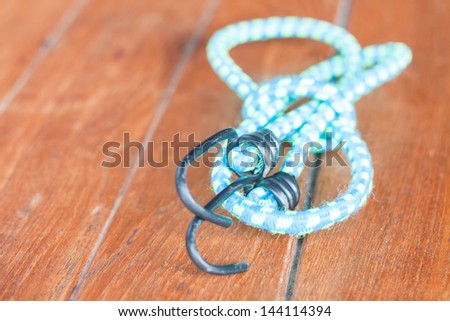 Light blue elastic rope with metal hooks