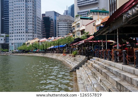 SINGAPORE - SEPTEMBER 21: Historical quay on southern bank of Singapore River on September 21, 2011 in Singapore. It was heart of old Port of Singapore in the past, now it hosts bars and restaurants.
