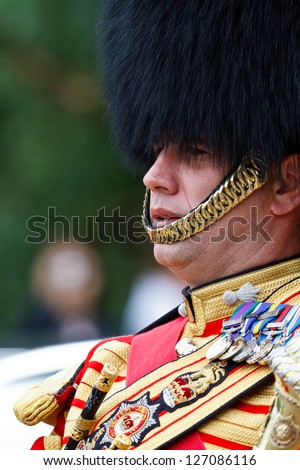 LONDON - JULY 4: Drum Major of Queen\'s Guard Marching Band on July 4, 2012 in London. Drum major is the leader of a marching band, usually positioned at the head of the band.