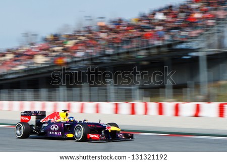 Barcelona - March 3: Sebastian Vettel Of Infiniti Red Bull Racing F1 Team Passes Grandstand With Spectators At Formula One Test Days At Catalunya Circuit On March 3, 2013 In Barcelona, Spain.