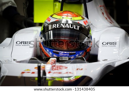 BARCELONA - MARCH 1: Pastor Maldonado of Williams F1 team with red LED reflection in his eyes at Formula One Test Days at Catalunya circuit on March 1, 2013 in Barcelona, Spain.