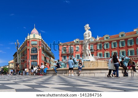 stock-photo-nice-france-may-people-hang-around-place-massena-on-may-in-nice-it-is-main-square-141284716.jpg