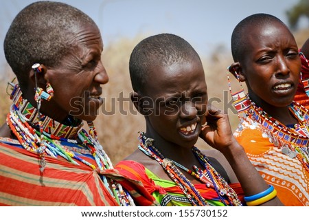 MTITO ANDEI, KENYA - JUNE 22: Maasai people from village in Tsawo West National Park on June 22, 2013 in Mtito Andei. The Maasai population has been reported as numbering 841,622 in Kenya.