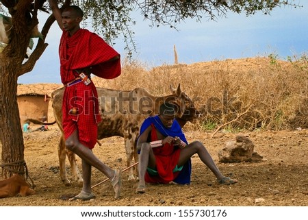 MTITO ANDEI, KENYA - JUNE 22: Maasai people from village in Tsawo West National Park on June 22, 2013 in Mtito Andei. The Maasai population has been reported as numbering 841,622 in Kenya.