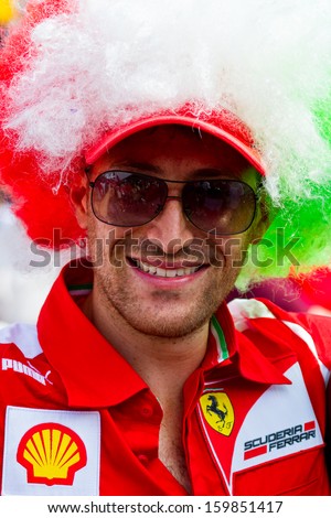 MONZA, ITALY - SEPTEMBER 8: Ferrari supporter during Formula 1 Grand Prix weekend on September 8, 2013 in Monza. Italian motor racing fans - tifosi - are well known for their love of Ferrari.