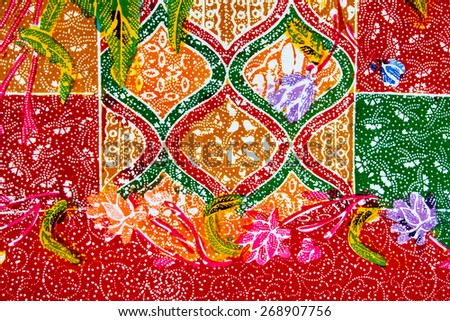 Batik design in Thailand for traditional clothes. Colorful Red Green Blue tone background and flower style.