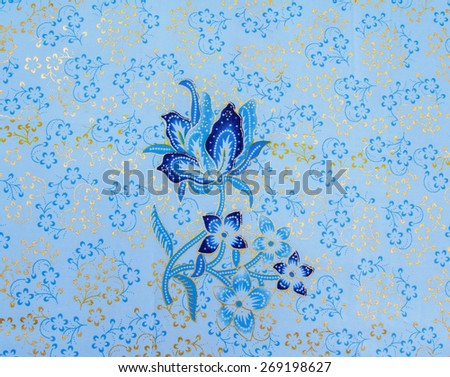 Batik design in Thailand for traditional clothes. Colorful blue tone background and leaf style. For creator design illustrator.