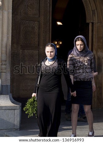 TBILISI, GEORGIA - APRIL 27:  People with palms prepared for the Palm Sunday in front of The Holy Trinity Cathedral of Tbilisi on April 27, 2013.