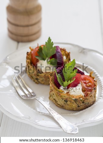 Healthy eating: baked, no fat version of potato pancakes served with vegetables.