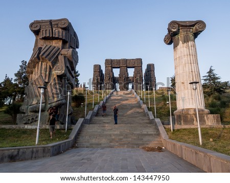 TBILISI, GEORGIA - JUNE 23: The Chronicle of Georgia (Stonehenge) in Tbilisi, Georgia, on June 23, 2013 at sunset. The Chronicle shows the history and religious believes of the country.