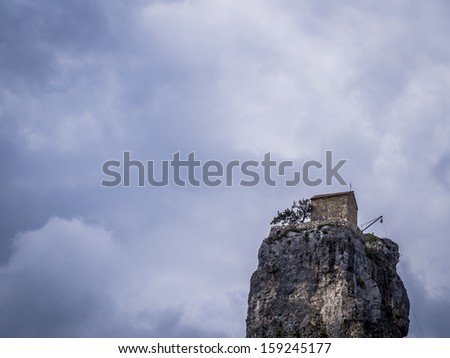 Katskhi pillar church in Georgia. Katskhi pillar is a small church constructed on a 40m high limestone pillar, what makes it one of the strangest attractions of Georgia.