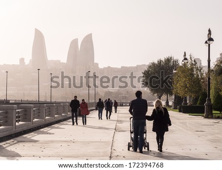 BAKU, AZERBAIJAN - NOVEMBER 22, 2013: Baku Boulevard at sunset. The boulevard was established in 1909 and today is a popular tourist attraction.