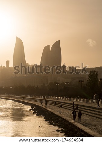 BAKU, AZERBAIJAN - NOVEMBER 22, 2013: Baku Boulevard at sunset. The boulevard was established in 1909 and today is a popular tourist attraction.