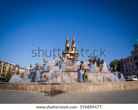 KUTAISI, GEORGIA - OCTOBER 31, 2013: Fountain on the central square in Kutaisi, Georgia. The fountain shows 30 statues of the Colchis.