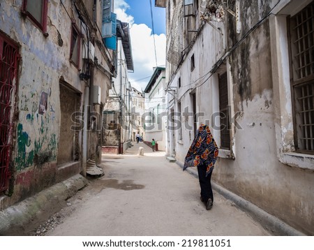 STONE TOWN, ZANZIBAR - AUGUST 30, 2014: One of the streets in Stone Town, the capital of Zanzibar. Stone Town is famous for its colonial architecture.