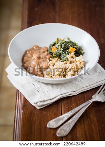 Traditional Tanzanian meal: rice and beans served with spinach.