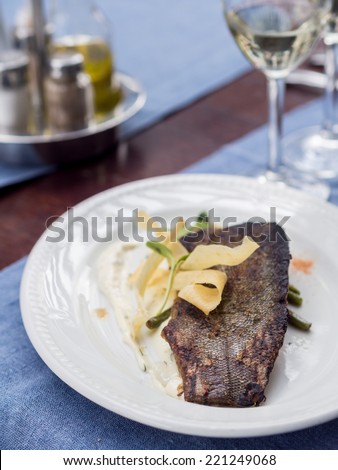 Latvian cuisine: fried tench fillet in a sweet-and-sour marinade with green beans and tartar sauce.